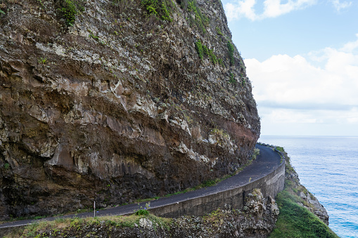 Dangerous part of the old road with rockfall. North coast of the island of Madeira.