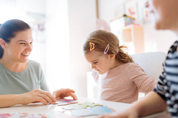 istock Mother and daughters playing and enjoying time together 1367563293