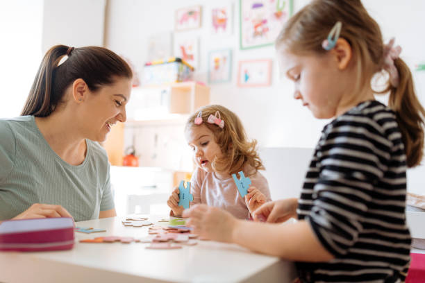 istock Mother and daughters playing and enjoying time together 1367563296