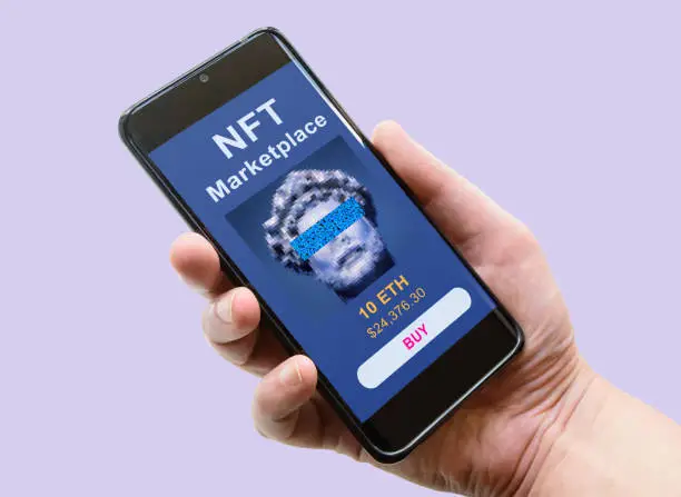 NFT art in phone, hand and smartphone with marketplace. NFT token is non-fungible cryptocurrency. Concept of blockchain, crypto tech, payment, digital wallet, transfer and virtual cryptography.