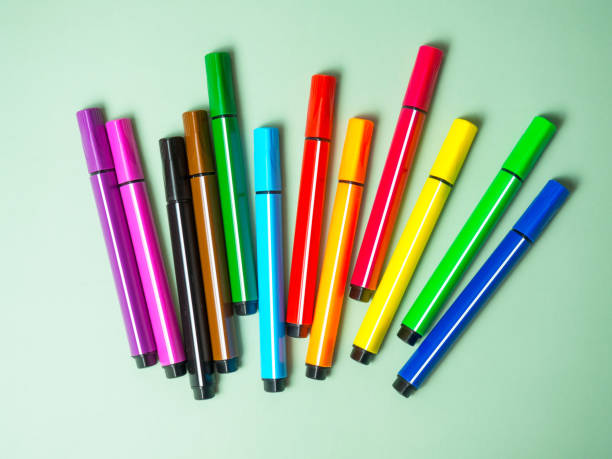 istock A set of multicolor felt-tip pens, multi-colored felt-tip pens on a green background with space for text 1367569344