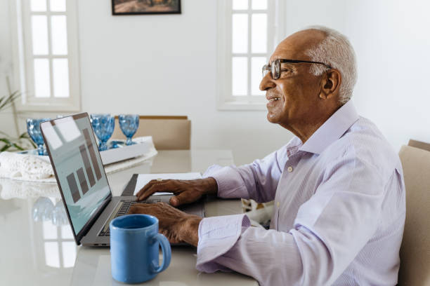 istock Senior man working from home on laptop 1367573362