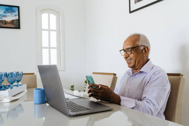 istock Senior man working from home on laptop 1367573411