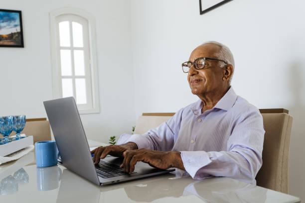 istock Senior man working from home on laptop 1367573412