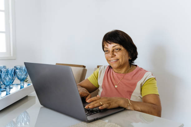 istock Mature woman using laptop 1367573480
