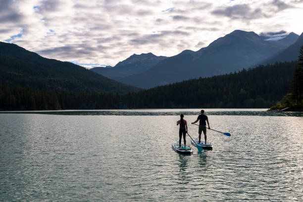 istock Couple on a paddle board adventure 1367578723
