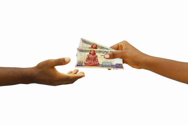 Close-up of clerk and customer holding exchange US dollar to Japan yen banknote on white background with clipping path