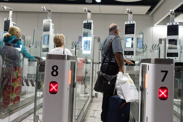 Air Travellers Pass through Automated Border Control at an Airport stock photo