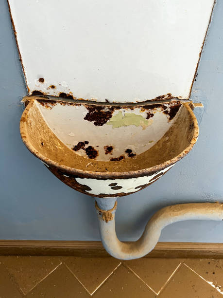 istock Abandoned building in ghost town Kolmanskop in desert. Rusty sink with sand 1367579598