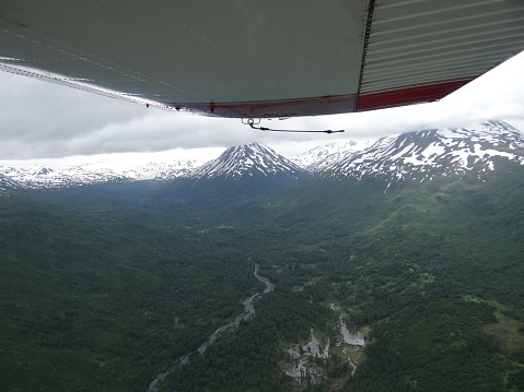 Kodiak Alaska mountain range Aerial view from a small plane, wing in foreground
