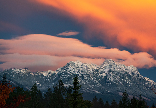 Mountain Alpenglow on Peaks - Scenic landscape with snowcapped mountains and pink alpenglow light at sunset. New York Mountains, Sawatch Range, Colorado USA.