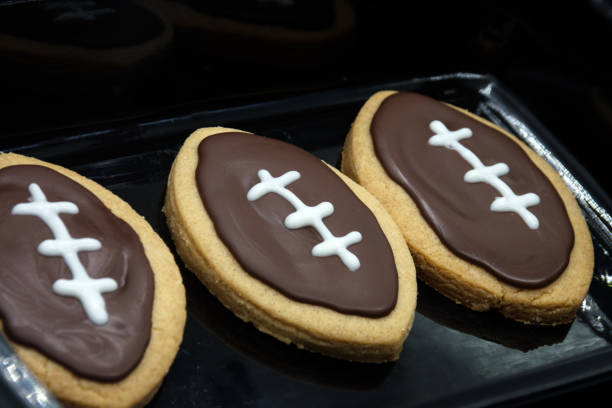 Super Bowl party cookies. Football shape cookies. Home made cookies concept Super Bowl party cookies. Football shape cookies. Home made cookies concept. . High quality photo round sugar cookie stock pictures, royalty-free photos & images