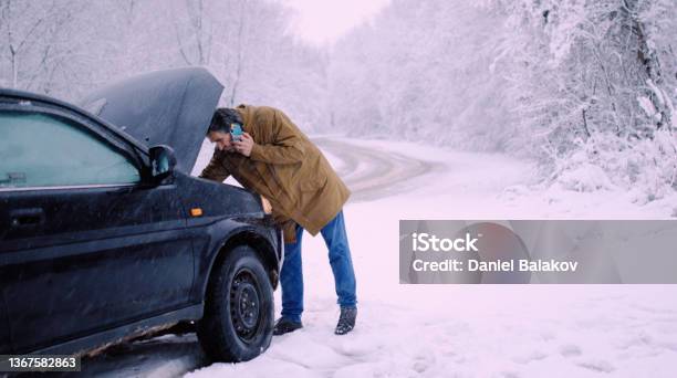 Man With Car Issues On Winter Road Phone Calling For Help Stock Photo - Download Image Now