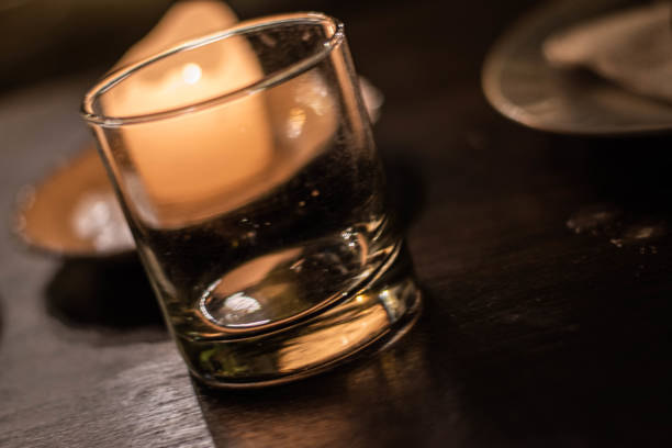 istock Glass in front of a candle 1367584047