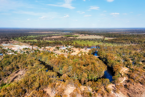 Loop of Murrumbidgee river around Balranald town in Australian outback plains - aerial landscape.