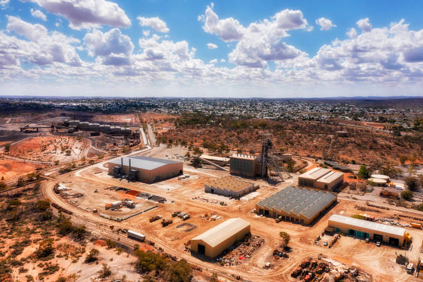 D BH Junction Mine clouds day Open pit minerals and metal ore Junction Mine in Broken hill silver city - elevater aerial cityscape. lead mine stock pictures, royalty-free photos & images