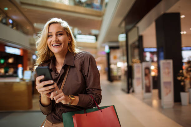 istock Checking all the online sales while in the shopping mall 1367592097