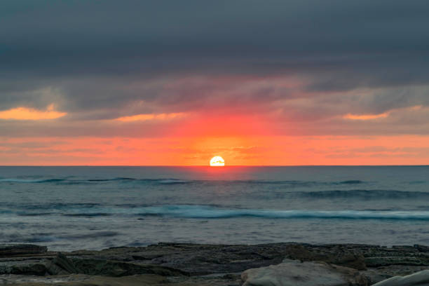 istock Sunrise seascape with rocky foreground 1367592230