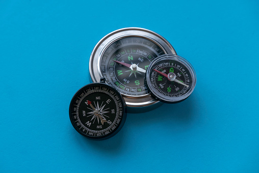 Compass on a blue background.