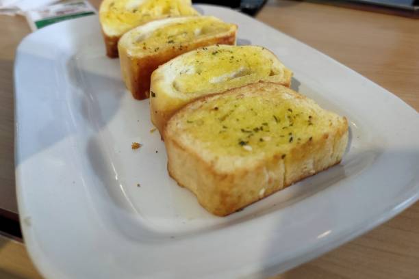 istock Garlic bread on the white plate 1367606950
