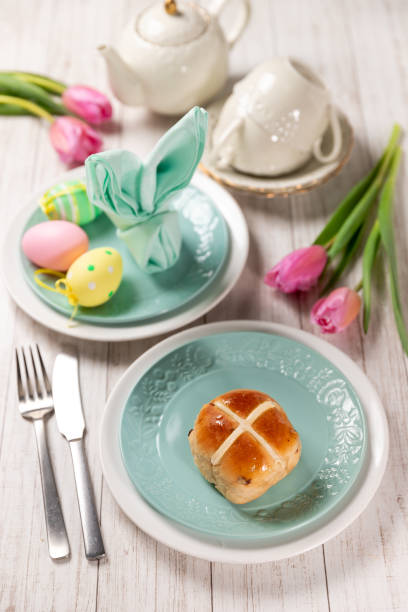 istock Easter festive dessert table with hot cross buns 1367609610