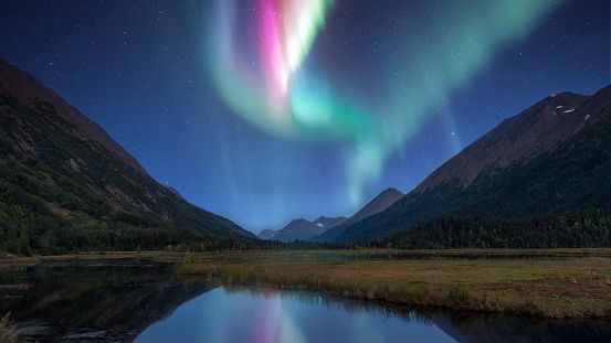 Alaska landscape of the amazing northern lights over a mountain lake on the Kenai peninsula