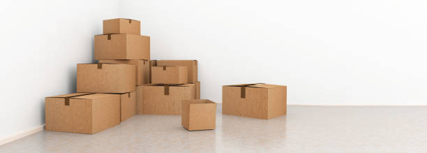 istock removal deliver parcels boxes pile on the floor of empty room with white wall for background - 3d rendering 1367617165