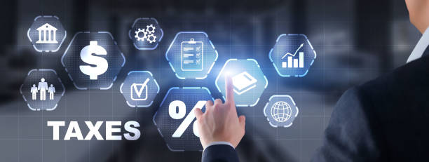 istock Tax payment. Businessman using virtual touchscreen presses tax button 1367620232