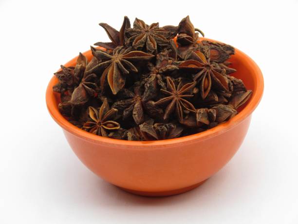 istock Star anise in a bowl isolated on white background 1367621752
