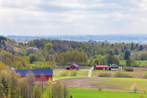 istock Farm in a rural landscape view in spring 1367622762