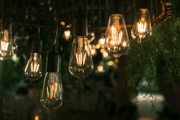 istock Beautiful warm incandescent led string light used as part of ceiling decor at a wedding reception. Shallow focus area. Background image. 1367623815