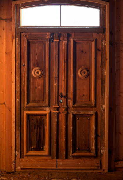 istock A backlit wooden historic door. 1367625782