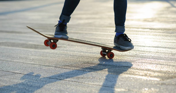 istock Skateboarder with skateboard outdoors in city 1367629378