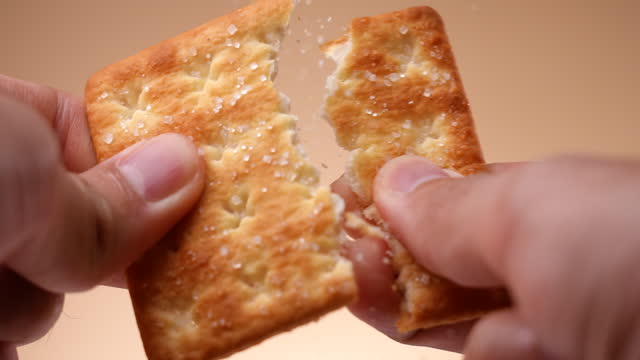 Break a cracker cookie in slow motion