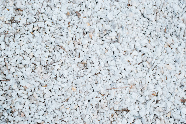 istock Small white decorative smooth stones outdoors, top view. Texture stone background 1367632493