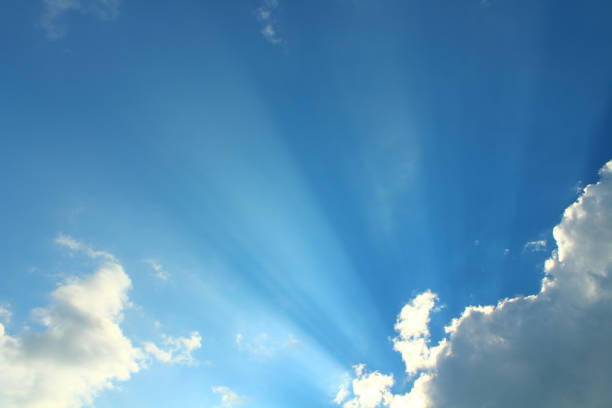 istock Large gray cumulus clouds and sun rays. A natural view. Background. Landscape. 1367632520