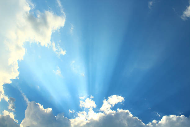istock A beautiful blue sky with large clouds and sunbeams. Background. Landscape. 1367633379