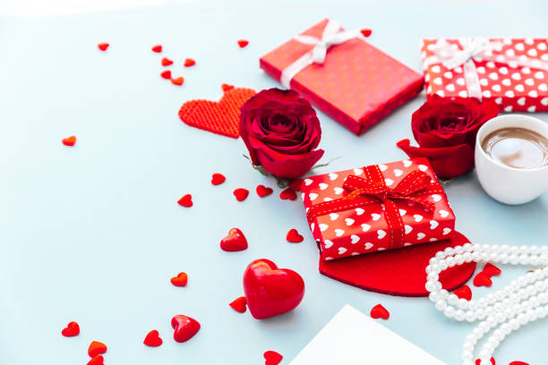 istock Valentine day composition with coffee cup, rose flower and gift box on table. Top view, flat lay. Holiday concept. 1367633909