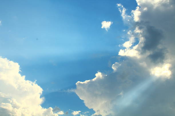 istock A beautiful blue sky with large clouds and sunbeams. Background. Landscape. 1367634632