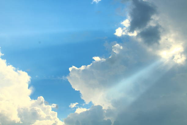 istock A beautiful blue sky with large clouds and sunbeams. Background. Landscape. 1367634634