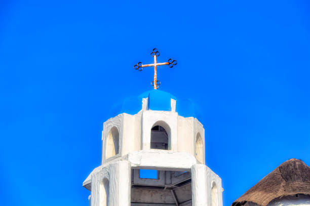istock Traditional blue coloured tower with cross at the top. 1367635988