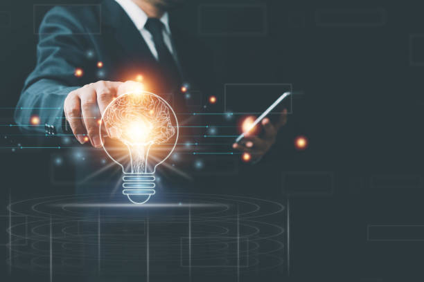 istock Light bulb with brain inside the hands of the businessman and point connecting network background. Creative The brain in the light bulb, The concept of the business idea. 1367636702