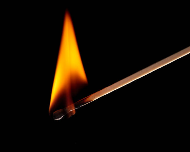 istock Burning match isolated on black background. Close-up. 1367638096