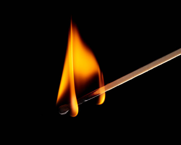 istock Burning match isolated on black background. Close-up. 1367638098
