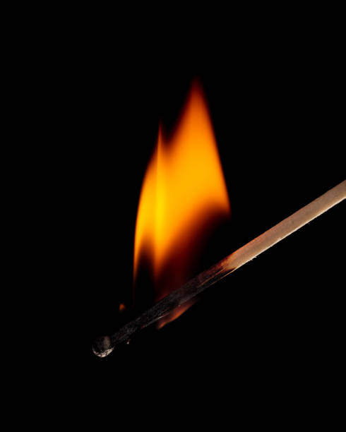 istock Burning match isolated on black background. Close-up. 1367638106