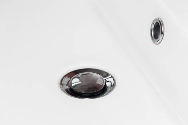 istock Drain in a white sink, background, close-up 1367638509