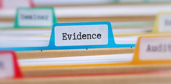 File folders with a tab labeled Evidence