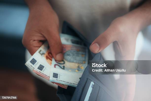 Young Man Holding In Hands Wallet With Euro Money Stock Photo - Download Image Now - European Union Currency, Euro Symbol, Currency