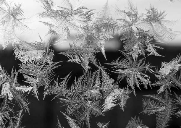 Beautiful natural frosty pattern on winter window. Ice pattern in winter time