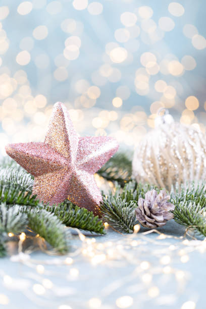 istock Christmas spruce with star and blurred shiny lights. 1367643843